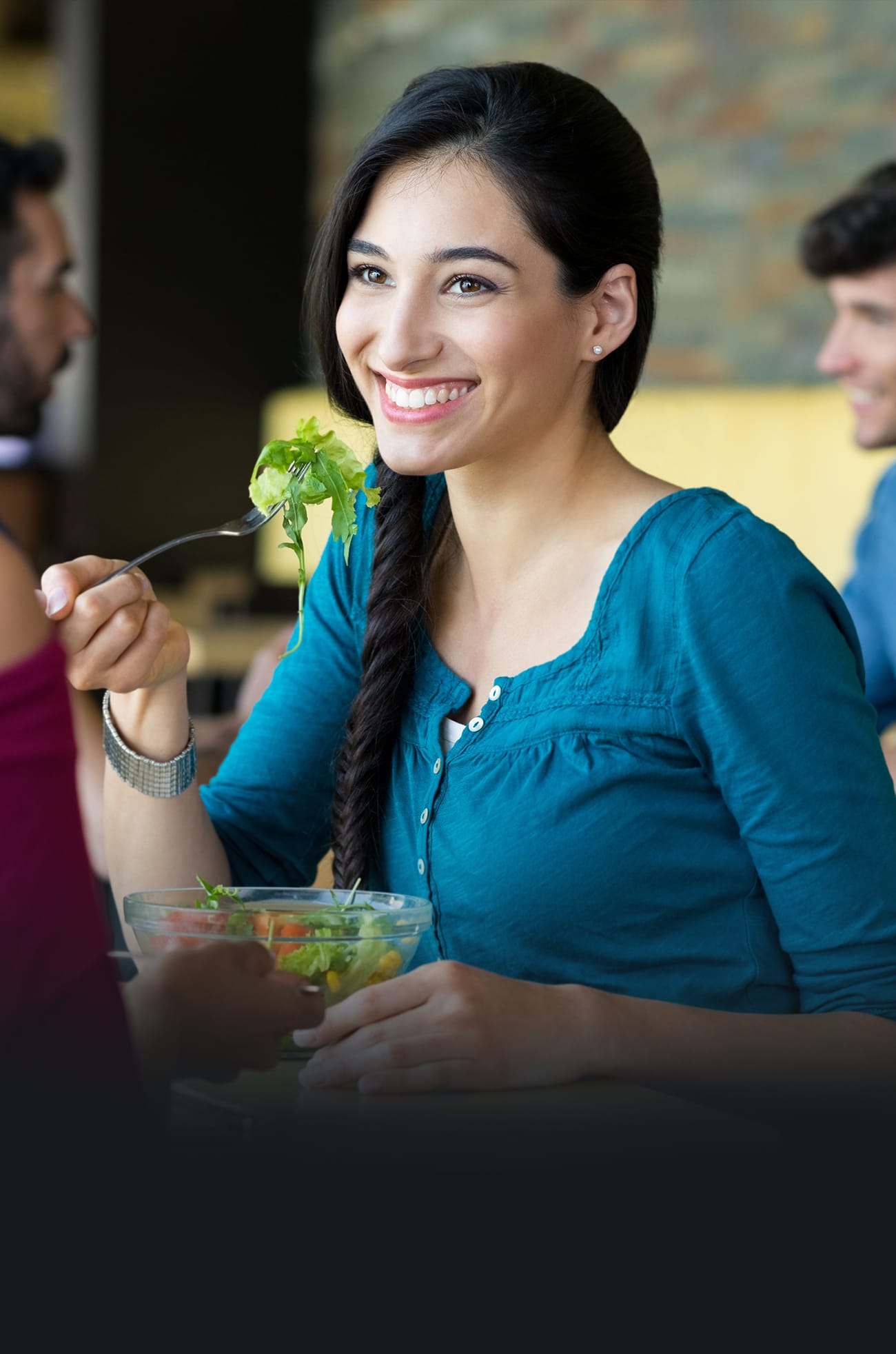 Dartcor Customized Corporate Food Services -smiling woman eating a salad